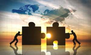 World Business teamwork puzzle pieces